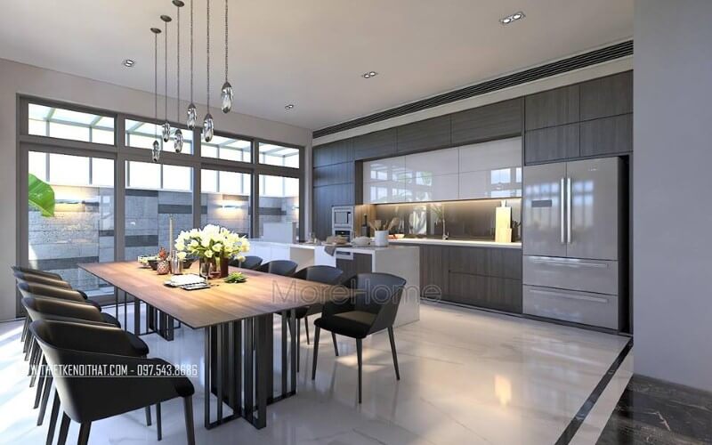 Bộ bàn ghế ăn, đèn thả, tủ bếp acrylic, laminate đã tạo nên vẻ đẹp sang trọng, độc đáo cho phòng ăn liền bếp. Thiết kế biệt thự