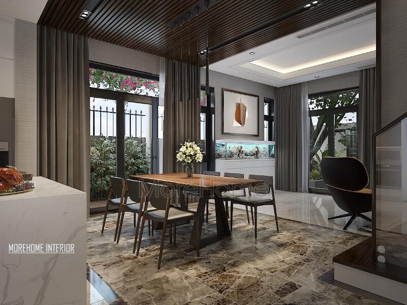 Trang trí phòng ăn hiện đại thông thoáng, chan hòa với thiên nhiên từ hệ cửa lớn giúp ánh sáng lan tỏa tối đa nhưng vẫn chắn nắng kịp thời từ rèm 2 lớp. Thiết kế biệt thự